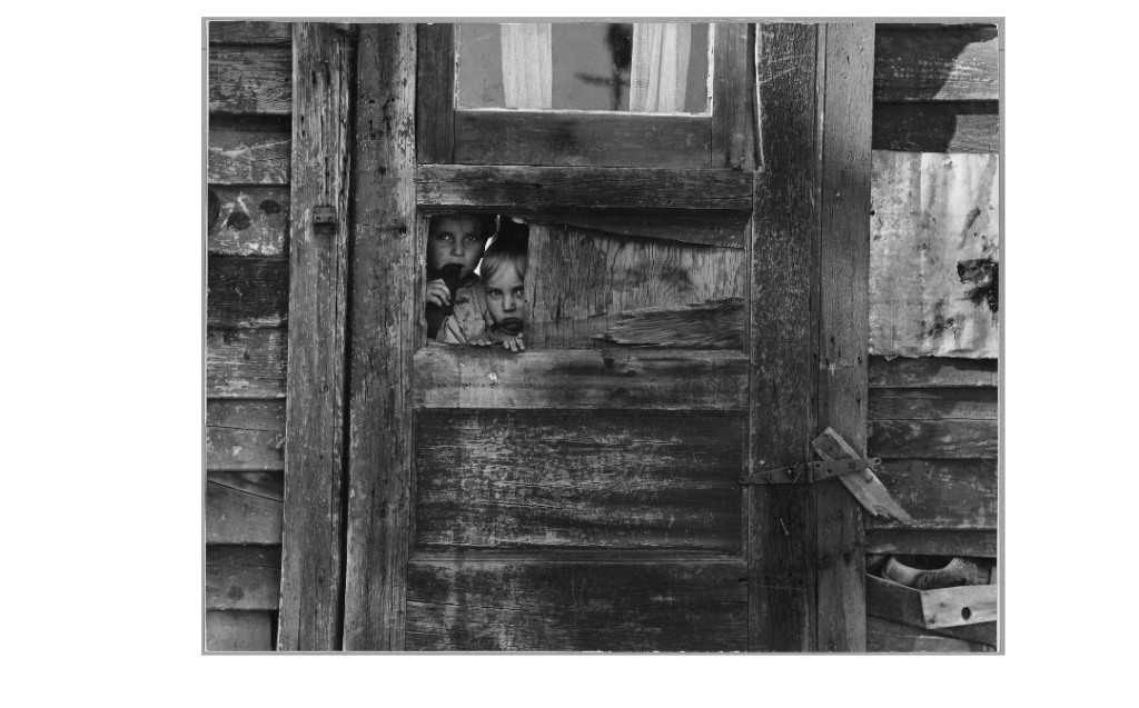 A-photograph-by-Dorothea-Lange-of-children-in-a-Kern-County-California-camp-near-Weedpatch-1940